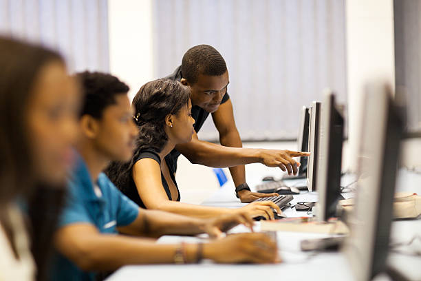 african american college students in computer room african american college students in computer room